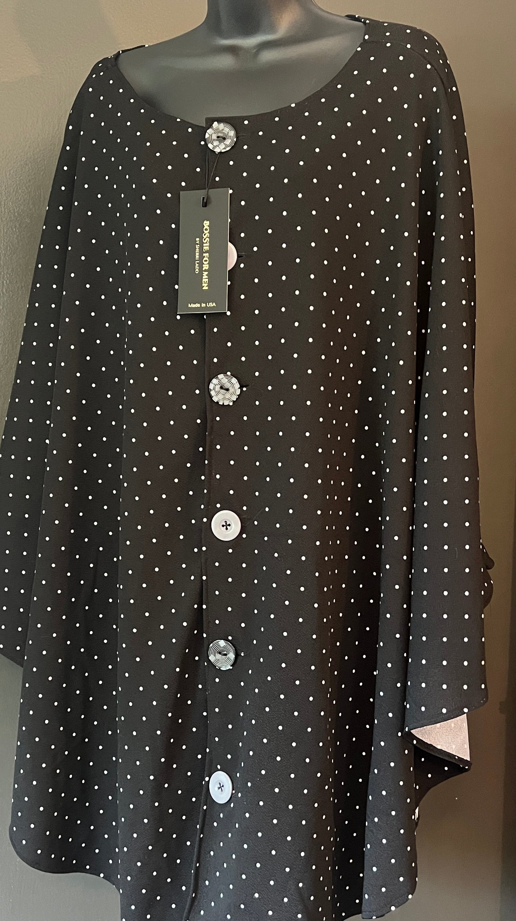 Time to be extraordinary with this BOSSIE, polka dot, free-arm cape! One Size M-XL